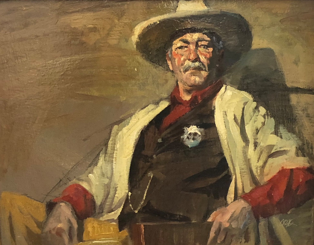 Portrait of older man in sheriff's outfit and cowboy hat