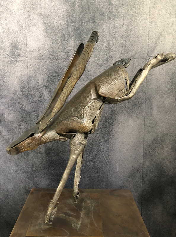 Abstract bronze sculpture of leaping hare