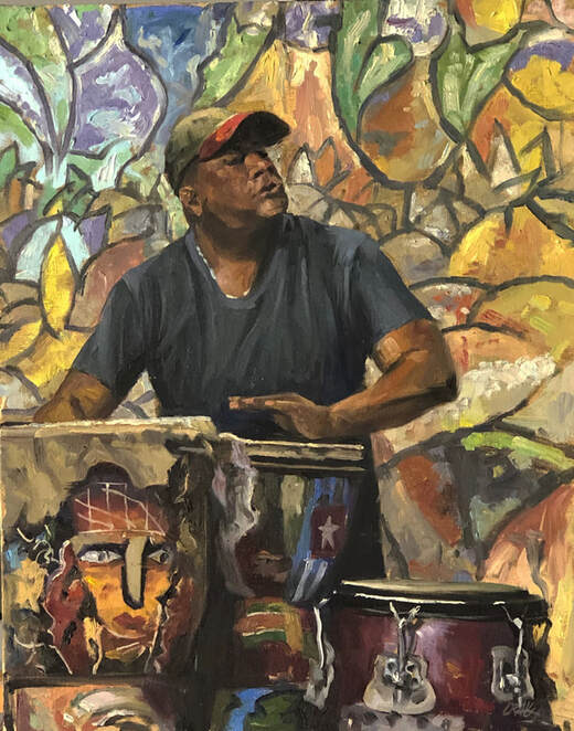 Man playing congas in front of wall mural