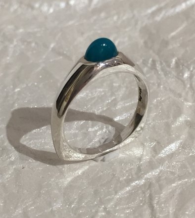 Ring with central gemstone