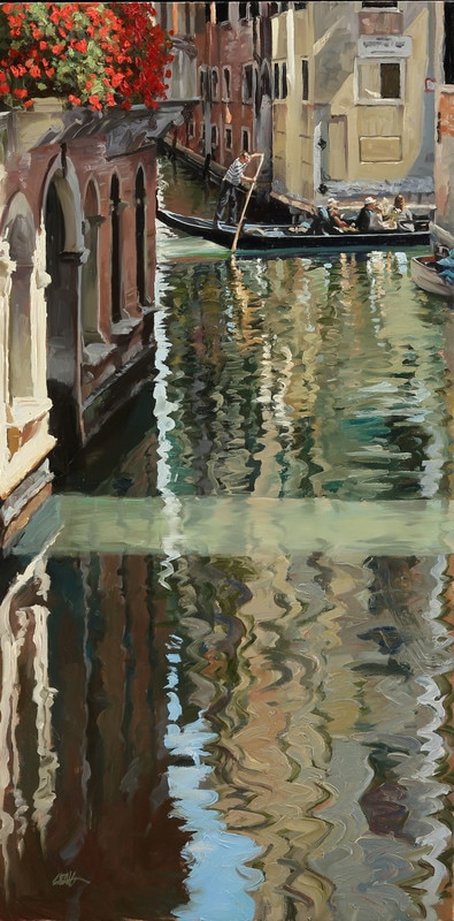 Gondola traveling through Venice canal