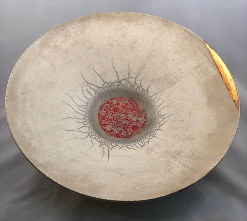 Raku fired platter with gilded edge and painted center