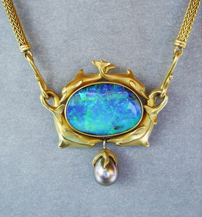 Image of 32 carat Black Opal in dolphin setting
