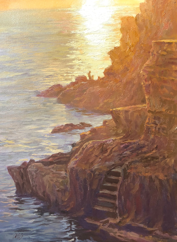 Landscape of coast line with staircase carved into the side of a cliff