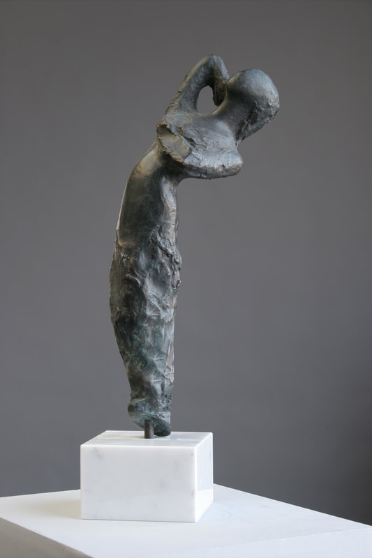 Abstracted sculpture of woman reaching upward