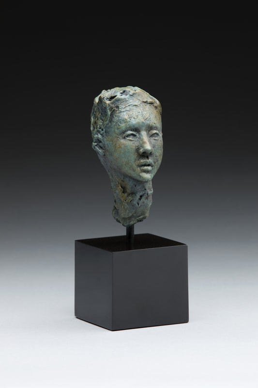 Bronze bust of woman
