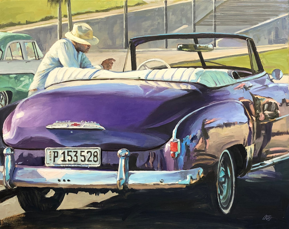Dapper man leaning on 1950s purple Chevrolet coup convertible