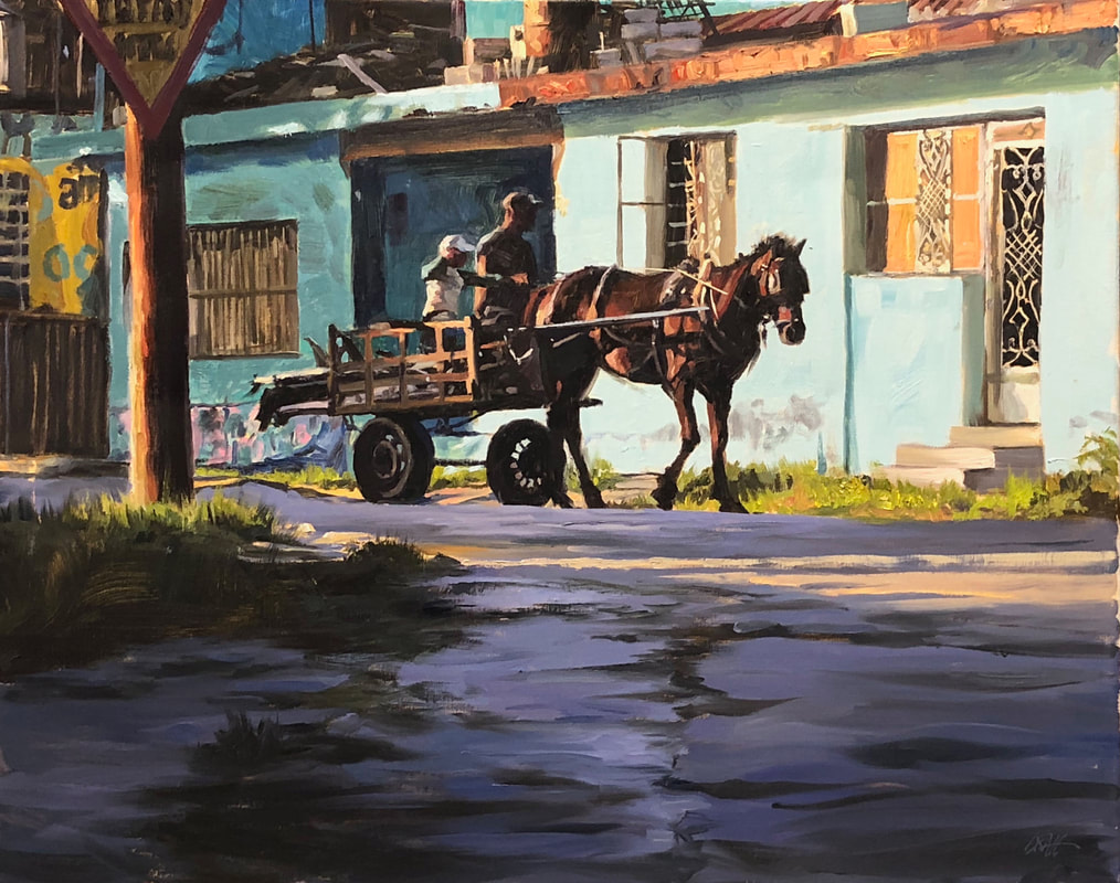 Street scene with horse pulling a cart with a father and child