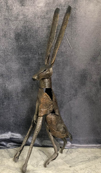 Abstract bronze sculpture of sitting jack rabbit