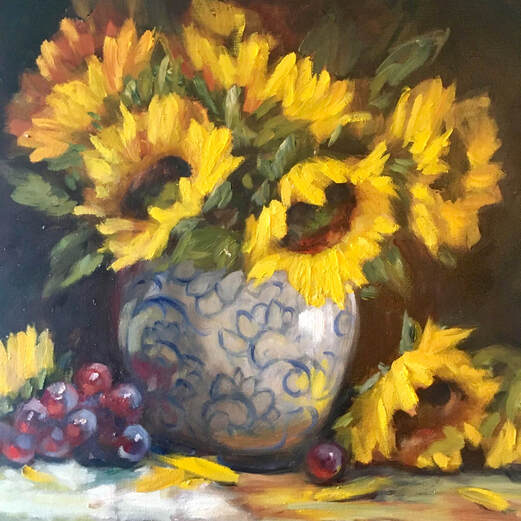 Still life of sunflowers in vase with grapes