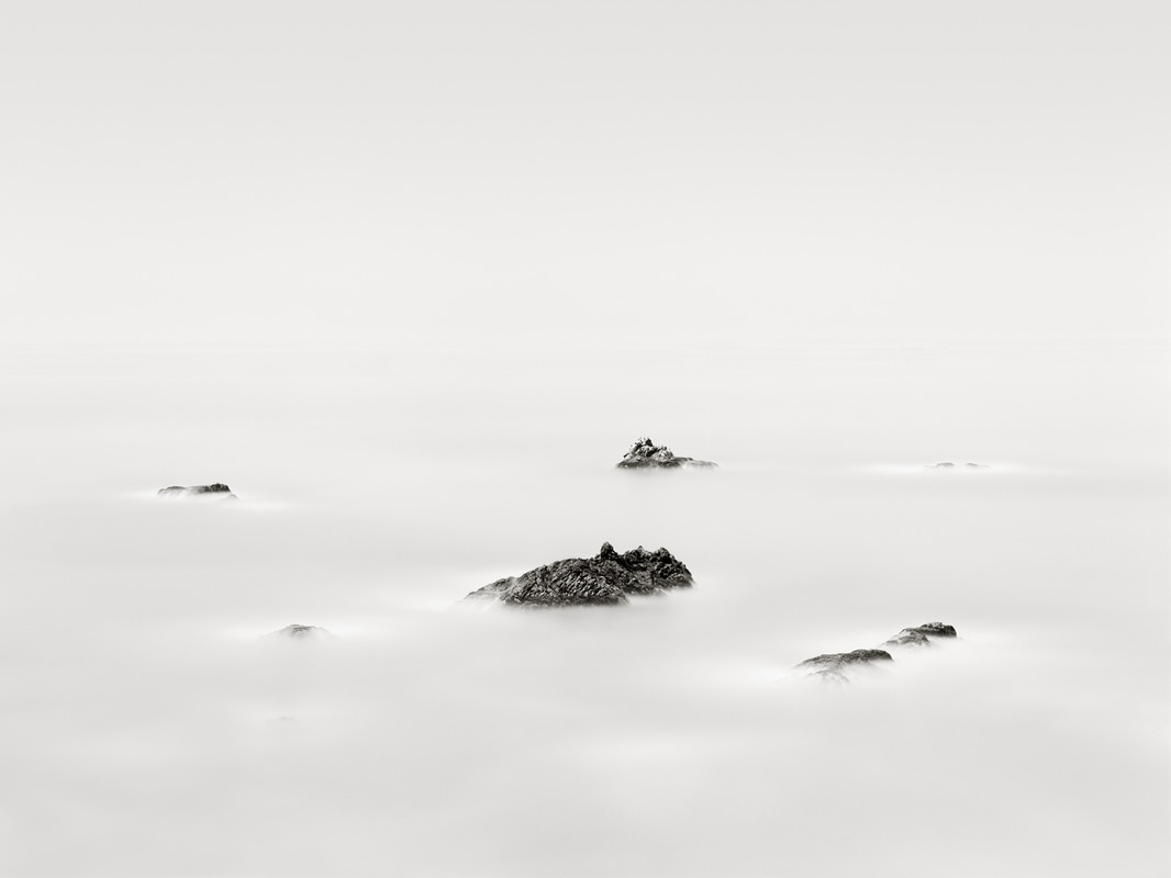 Black and white photograph of foggy landscape