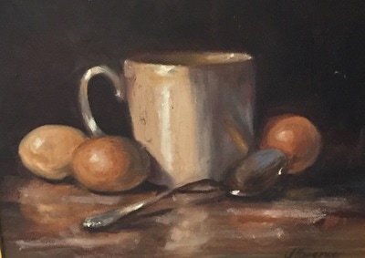 Still life of ceramic mug with eggs and spoon