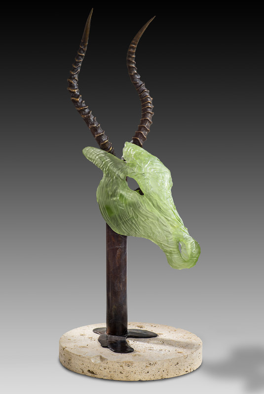 Glass and bronze sculpture of antelope head