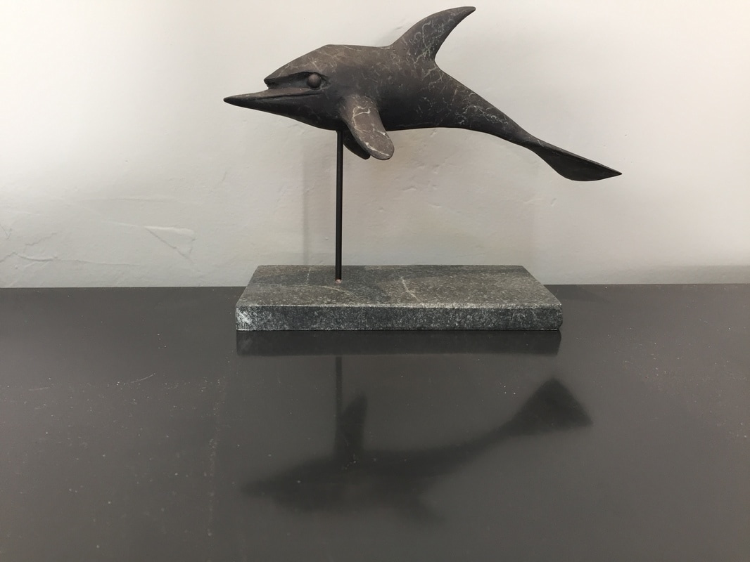 Abstract bronze sculpture of bottle nose dolphin