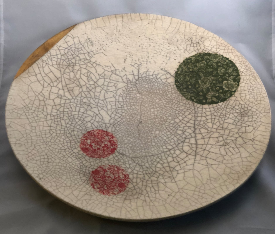 Raku fired platter with gilded edge and painted flowers