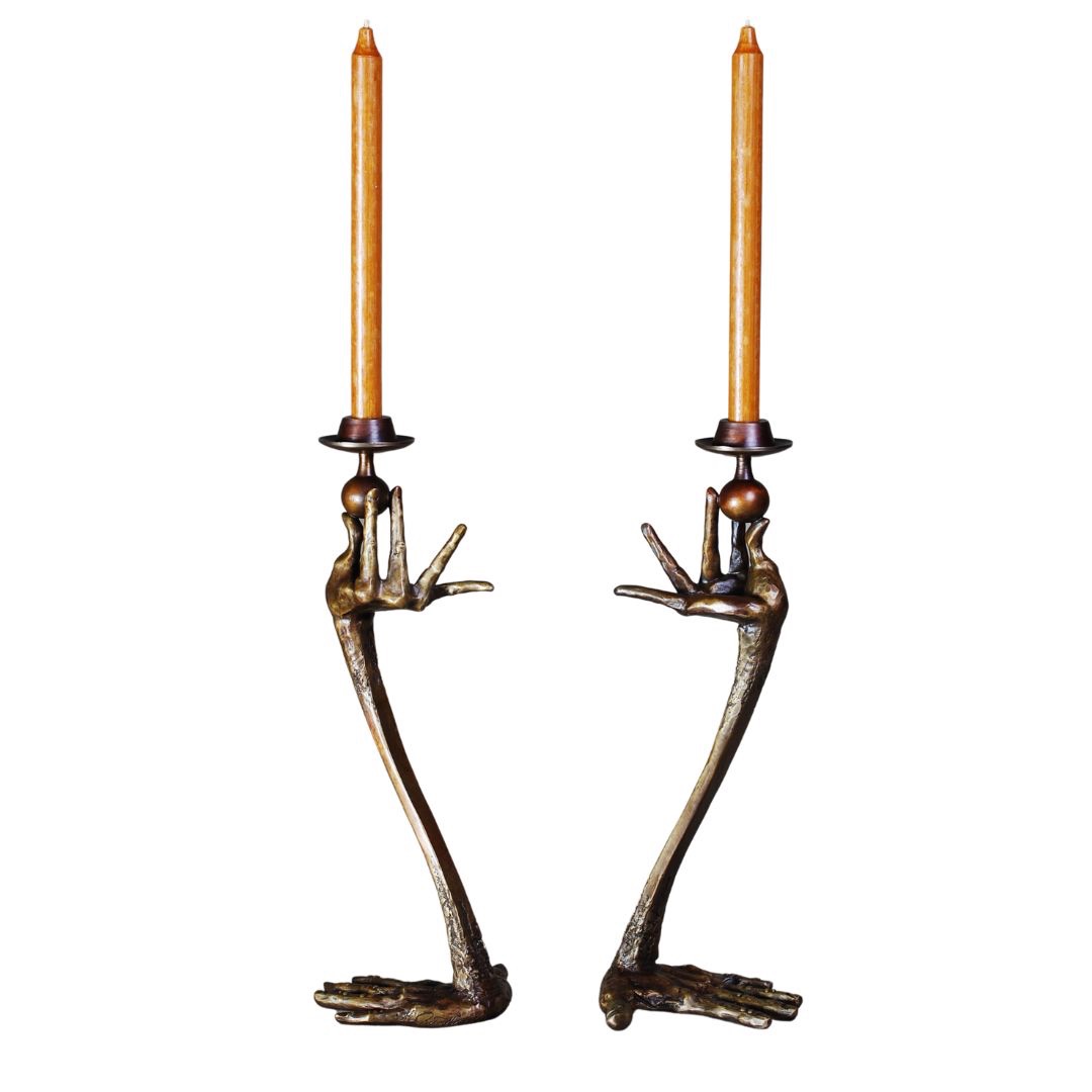 Bronze candlesticks with hands