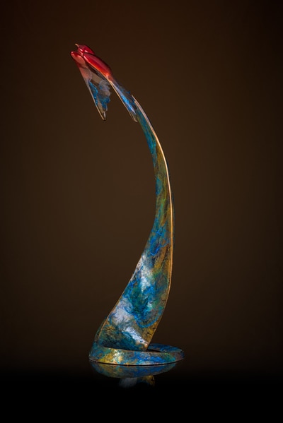 Bronze sculpture of bird in flight with pedestal 
