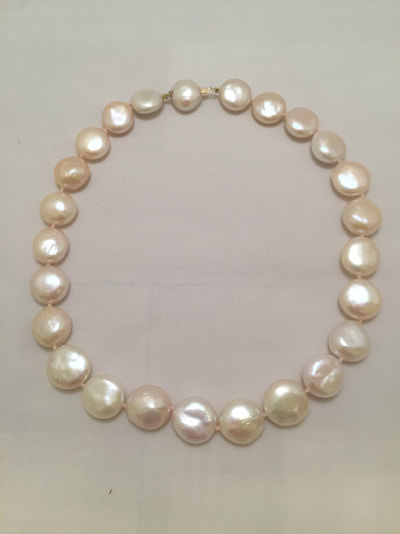 Single strand necklace of pink pearls