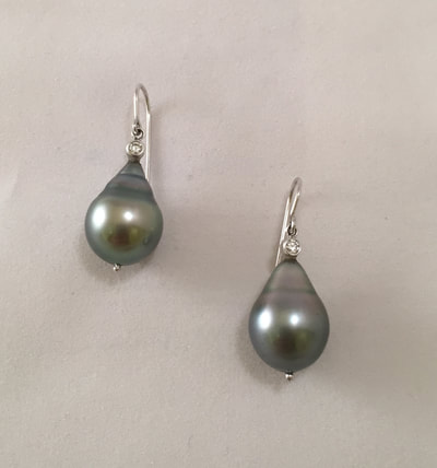 Drop black pearl earring with small diamonds