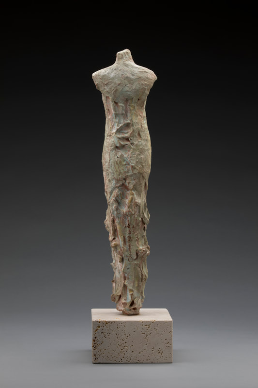 Back view of abstract sculpture of female body