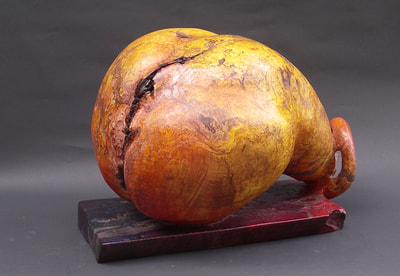 Front view of Sexy maple burl pear sculpture